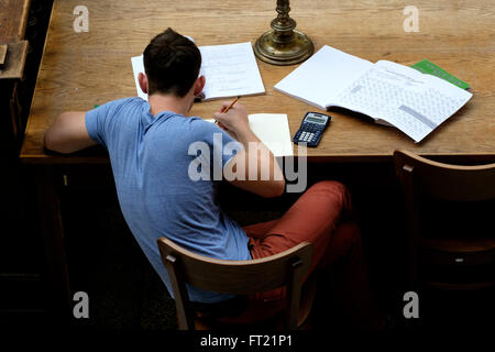 Overhead view of a student studying with bad posture Stock Photo