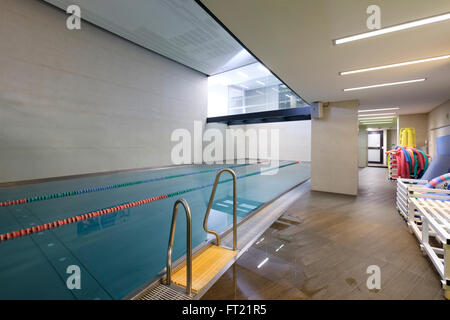 Indoor swimming pool entry ladder Stock Photo