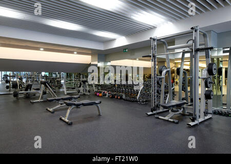 Weight lifting stations at an empty gym Stock Photo - Alamy