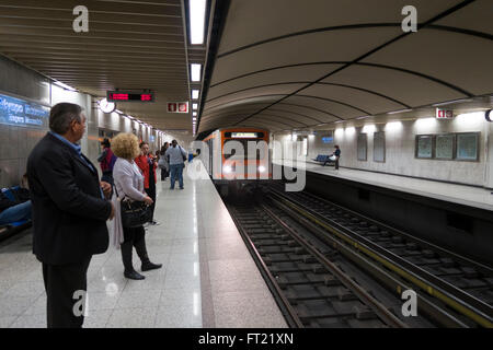 People waiting for subway train at the Megaro Moussikis underground station in Athens, Greece, Europe Stock Photo