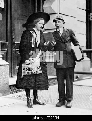 A young 19 year old American suffragette, Fay Hubbard, selling suffragette newspapers on the streets of New York, February 1910. Stock Photo