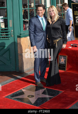 LOS ANGELES, CA - DECEMBER 8, 2015: Actor Rob Lowe with wife Sheryl Berkoff on Hollywood Boulevard where Lowe was honored with the 2,567th star on the Hollywood Walk of Fame. Stock Photo