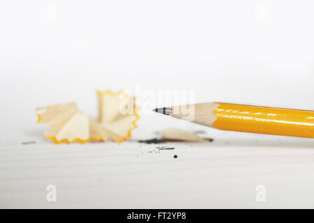 sharp yellow pencil on white Stock Photo