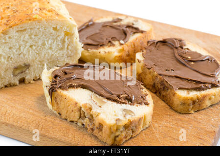 Chocolate cream on a homemade walnut bread slices Stock Photo