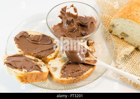 Chocolate cream on a homemade walnut bread slices Stock Photo
