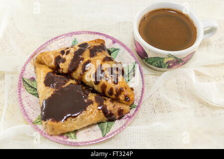 Homemade baklava on a plate and hot cup of coffee Stock Photo