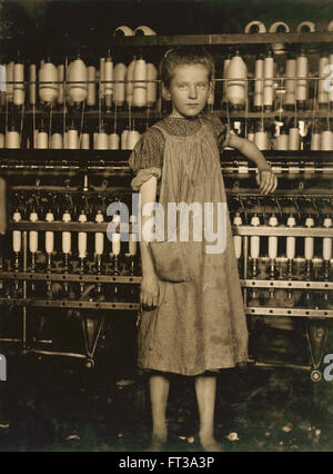 Portrait of Young Girl Working as Spinner at Cotton Mill, Vermont, USA, circa 1910 Stock Photo