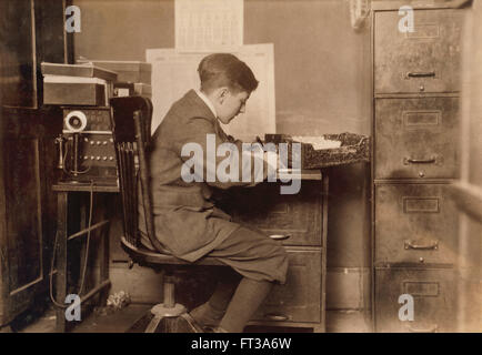 Young Office Boy, J.J. O'Brien and Sons, New York City, New York, USA, circa 1917 Stock Photo