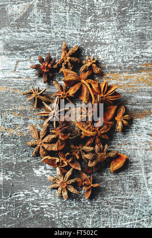 Food Background with Heap of Star Anise on Vintage Black Table. View from Above. Stock Photo