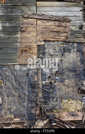 Wooden surface from pieces of rotten spotty wooden boards. planks and  panels. Abstract background Stock Photo
