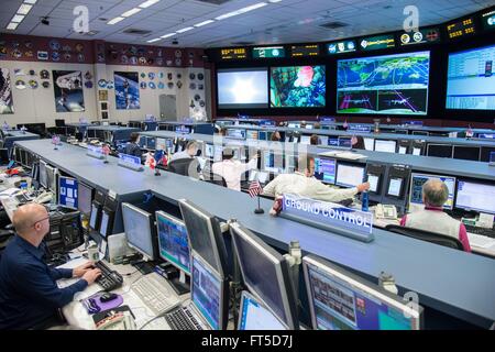 NASA Expedition 47/48 flight control team monitor the launch of the Soyuz TMA-20M spacecraft at mission control at the Johnson Space Center March 18, 2016 in Houston, Texas. Stock Photo