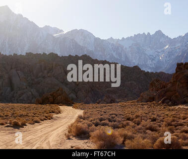 dirt road with high Sierra mountains in background near Lone Pine, California, USA Stock Photo