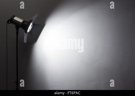 Lighting equipment on a black background old shabby wall Stock Photo