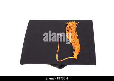 Black Graduation Hat with Gold Tassel isolated on white background. Stock Photo