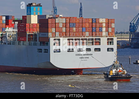 Containership with tug boat on Elbe, Hamburg Harbour, Hamburg, Germany, Europe Stock Photo