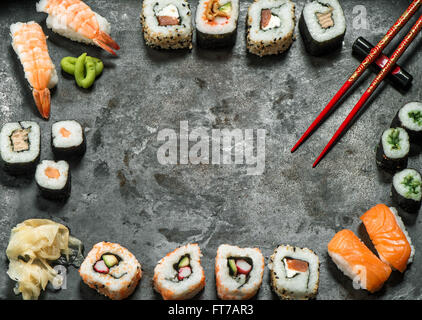 Traditional japanese food. Sushi rolls, nigiri, salmon, wasabi, shrimp, tuna, ginger, tofu, rice, avocado, pickled ginger. Asian Stock Photo