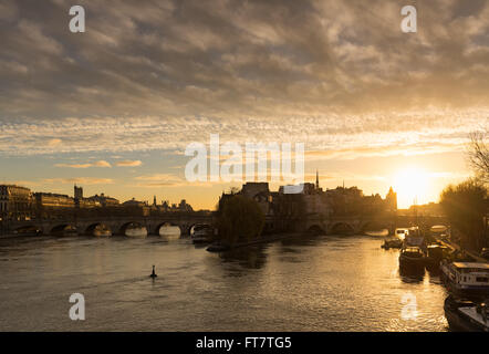 Winter sunrise on the Ile de La Cite, Pont Neuf and the Seine River in the 1st Arrondissement of Paris, France Stock Photo