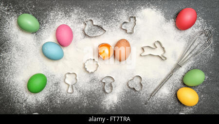 Cookies ingredient and colored easter eggs. Food background Stock Photo