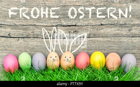 Easter eggs cute bunny. Funny decoration. Frohe Ostern - Happy Easter in german Stock Photo