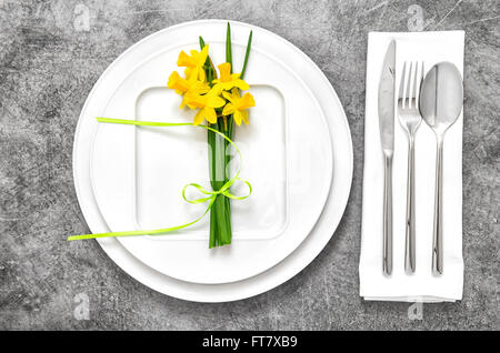 Festive able place setting with spring flowers decoration Stock Photo