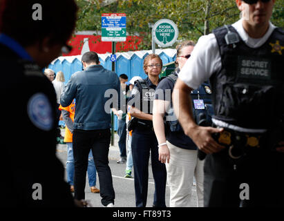 U.S. Customs and Border Protection (CBP) Officer Denice Jackson provides a law enforcement presence at a security checkpoint before Pope Francis' mass in Philadelphia September 27, 2015. CBP contributed to Papal security in Washington, D.C., New York City and Philadelphia during the Pope's weeklong visit to the United States. (CBP Photo/Steve Sapp) Stock Photo