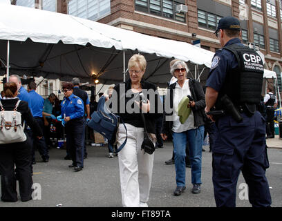 U.S. Customs and Border Protection (CBP) Officer Terry Russell (right) provides a law enforcement presence at a security checkpoint before Pope Francis' mass in Philadelphia September 27, 2015. CBP contributed to Papal security in Washington, D.C., New York City and Philadelphia during the Pope's weeklong visit to the United States. (CBP Photo/Steve Sapp) Stock Photo