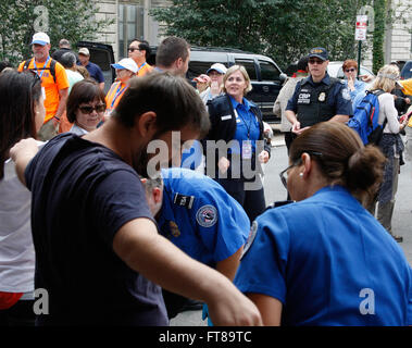 U.S. Customs and Border Protection (CBP) Officer Terry Russell (right) provides a law enforcement presence at a security checkpoint before Pope Francis' mass in Philadelphia September 27, 2015. CBP contributed to Papal security in Washington, D.C., New York City and Philadelphia during the Pope's weeklong visit to the United States. (CBP Photo/Steve Sapp) Stock Photo