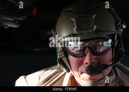 Davis Monthan Air Force Base, Tucson Arizona - An Air and Marine Operations Agent in the back of a Blackhawk helicopter prepares to conduct fast rope training. Photo by: Dan Barrios Stock Photo