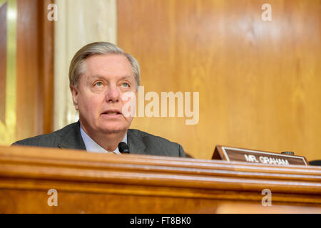 U.S. Senator Lindsey Graham of South Carolina addresses U.S Secretary of State John Kerry on February 24, 2016, as he prepares to testify before the Senate Appropriations Committee on Foreign Operations on Capitol Hill in Washington, D.C. [State Department photo/ Public Domain] Stock Photo
