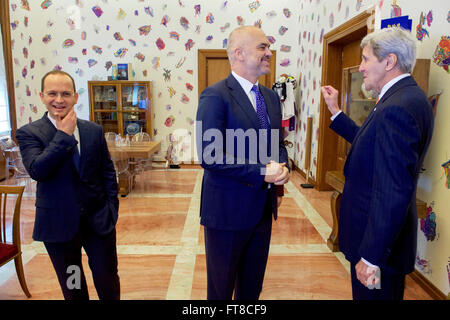 U.S. Secretary of State John Kerry chats with Albanian Prime Minister Edi Rama and Foreign Minister Ditmir Bushati in the Prime Minister's private office in the Prime Ministry in Tirana, Albania, where the Secretary arrived on February 14, 2016, before they participate in a bilateral meeting. [State Department photo/ Public Domain] Stock Photo