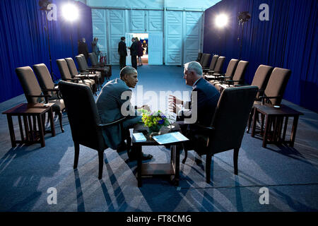 Nov. 17, 2015 'Taking advantage of the lights set up for a press statement, I maneuvered behind the President to make this photograph of him talking with Prime Minister Malcolm Turnbull of Australia as they concluded their meeting in Manila.' (Official White House Photo by Pete Souza) Stock Photo