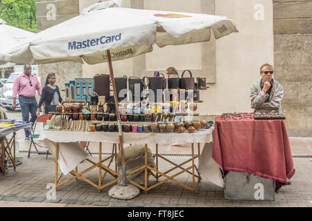 STREET VENDOR IN CONSTITUTION PLAZA, MONTIVIDEO, URUGUAY - CIRCA DECEMBER 2015. A multitude of arts, crafts, and scond-hand item Stock Photo