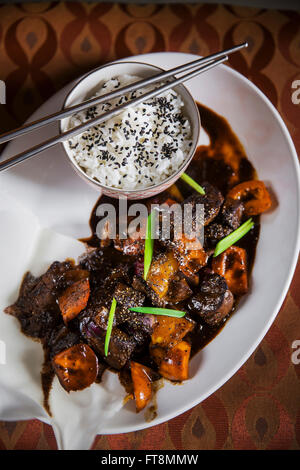 Asian dish - beef in black pepper sauce, with rice Stock Photo