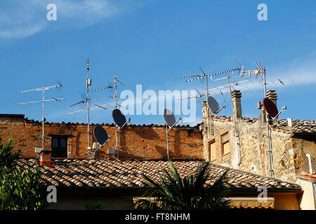 Television antennas in the roof tops Stock Photo