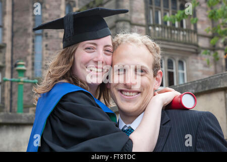 Edinburgh, City of Edinburgh, Scotland. Young couple celebrating graduation from the University of Edinburgh. Stock Photo