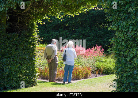 Edinburgh, City of Edinburgh, Scotland. Elderly couple admiring colourful blooms in the Royal Botanic Garden. Stock Photo