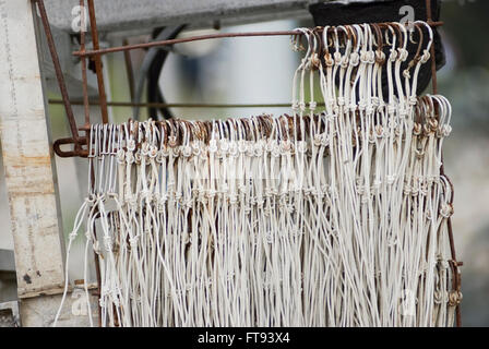 Fishing hooks on a blurred background Stock Photo