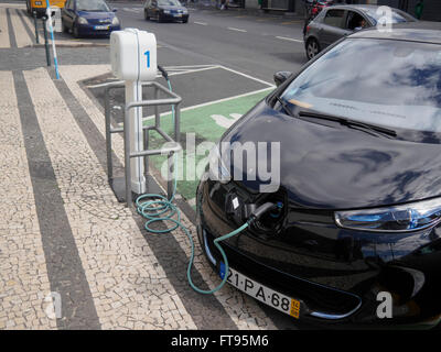 Electric car being charged at public charging point, Madeira, Portugal, March 2016 Stock Photo