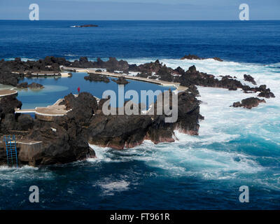 Porto Moniz, natural volcanic swimming pools on beach amongst rocks, Madeira, March 2016 Stock Photo