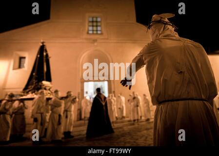 San Lorenzo Maggiore, Italy. 25th Mar, 2016. On the afternoon of Good Friday, during the Holy Week held the Penitential procession of the 'Battenti'. Dozens of hooded brothers with a crown of thorns on their heads, parade through the streets of the village, flagellating themselves as a sign of penance with discipline (whip with iron plates and chains). Hundreds of Easter processions take place in southern Italy during Holy Week, drawing thousands of visitors. Credit:  Michele Amoruso/Pacific Press/Alamy Live News Stock Photo