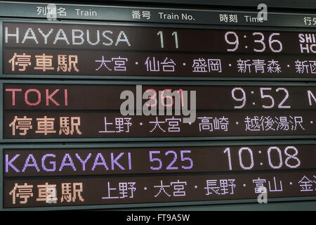Tokyo, Japan. 26th Mar, 2016. The notice board shows the timetable of the new Hayabusa Shinkansen (bullet train) at Tokyo Station on March 26, 2016, Tokyo, Japan. The Hayabusa shinkansen connects Tokyo with the northern island of Hokkaido via the 53.85 km long Seikan Tunnel. Previously Japan's bullet train only operated as far as Aomori but the new rail link now goes to Shin-Hakodate-Hokuto Station in Hokkaido with a further extension planned to Sapporo by 2030. A one way ticket costs 22,690 yen (200 UDS) from Tokyo to Shin-Hakodate Hokuto and the fastest trains will take 4 hours and 2 minutes Stock Photo