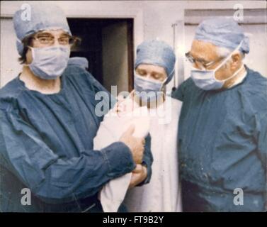 1978 - The World's First Test Tube Baby: At 23.47 Bst on July 1978 a unique baby was born in Britain-the result of a test tube fertilization. Louise Joy Brown, the 5 lb 12 oz daughter of Mr. & Mrs. Brown of Bristol, was delivered safely by caesarian section by Patrick Steptoe Esq. Frocs Frcog, Honorary Consultant Gynaecologist at the Oldham General Hospital near Manchester. He was assisted by Dr. John Webster MB ChB MRCOG, by Dr. Finlay Campbell, Anaesthetist Theatre, Sister Astel and Sister Marshall. Dr. Hilson Consultant Paediatricial. Also present at the birth was Dr. Robert Edwards the Cam Stock Photo