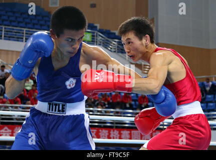 Qian'an, China's Hebei Province. 26th Mar, 2016. Enkh-Amar Kharkhuu(R) of Mongolia competes with Jan Chun-Hsien of Chinese Taipei during their men's 52kg category of Asia/Oceania Zone boxing event qualifier for 2016 Rio Olympic Games in Qian'an, north China's Hebei Province, March 26, 2016. Enkh-Amar Kharkhuu won the match 3-0. Credit:  Yang Shiyao/Xinhua/Alamy Live News Stock Photo