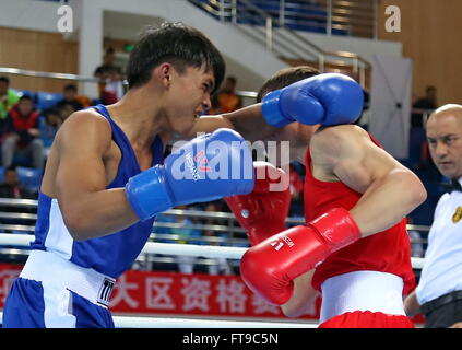 Qian'an, China's Hebei Province. 26th Mar, 2016. Lai Chu-En(L) of Chinese Taipei competes with Hursand Imankuliyev of Turkmenistan during their men's 52kg category of Asia/Oceania Zone boxing event qualifier for 2016 Rio Olympic Games in Qian'an, north China's Hebei Province, March 26, 2016. Lai Chu-En won the match 2-1. Credit:  Yang Shiyao/Xinhua/Alamy Live News Stock Photo