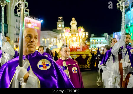 Spain, Madrid March 25th 2016. Brotherhood members leading the procession in Sol.  The procession of Jesus of Medinaceli and Our Lady of Sorrows on Good Friday took place from the Basilica of Jesus of Medinaceli Madrid, Spain. Credit:  Lawrence JC Baron/Alamy Live News. Stock Photo