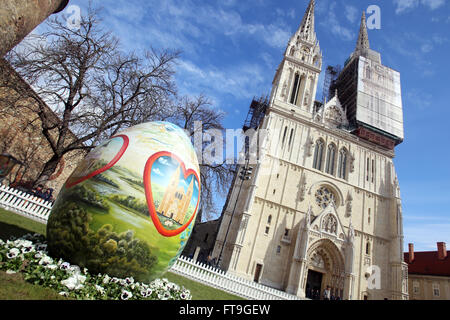 ZAGREB, CROATIA - MARCH 26, 2016 : Three easter eggs painted with technique naive by hand are placed on the Kaptol square in front of Zagreb Cathedral, Croatia. Credit:  PhotoJa/Alamy Live News Stock Photo