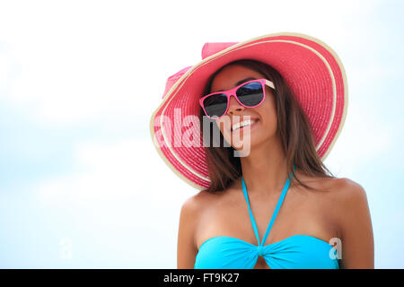 Portrait of a beautiful young woman in sunhat Stock Photo