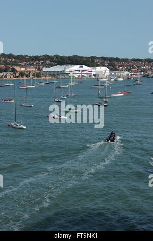 View from Red Funnel ferry to Southampton as leaving East Cowes ferry terminal.  Venture Quays (ex British Hovercraft hanger) Stock Photo