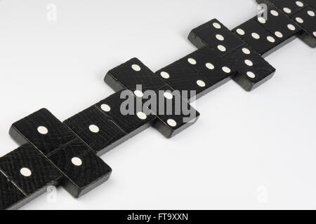 Composition of lying black domino bricks with white dots Stock Photo