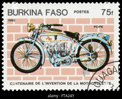 BUDAPEST, HUNGARY - 18 march 2016:  a stamp printed in Burkina Faso shows image of a vintage motorcycle, Pope, circa 1985 Stock Photo